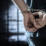 Arrested man in handcuffs with handcuffed hands behind back in prison Dua Pelaku Pencurian 7 Laptop Sekolah di Kendal Berhasil Diringkus - Info Seputar Pati